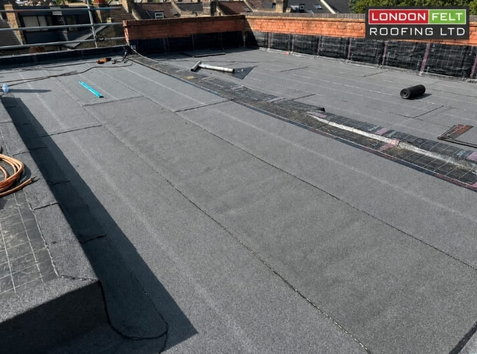 Mineral cap sheet installed across the field area of the roof